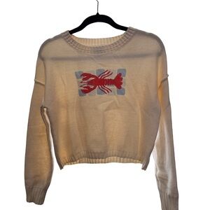 Bouffant’s and broken hearts lobster sweater